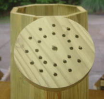 Wooden watering can spout with holes