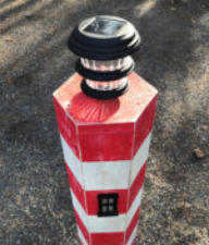 You can use your own solar pathway light on top of the lighthouse.