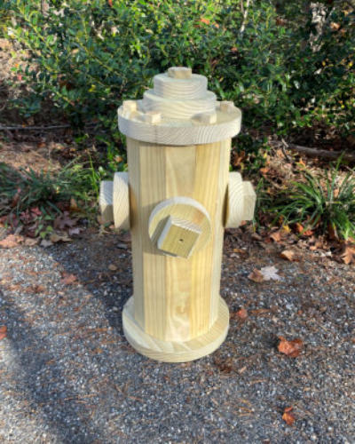 Wooden fire hydrant in natural wood theme