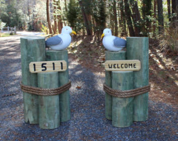 Seagulls on pilings house signs