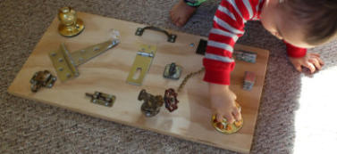 DIY Toddler Activity Board using Hinges and Knobs